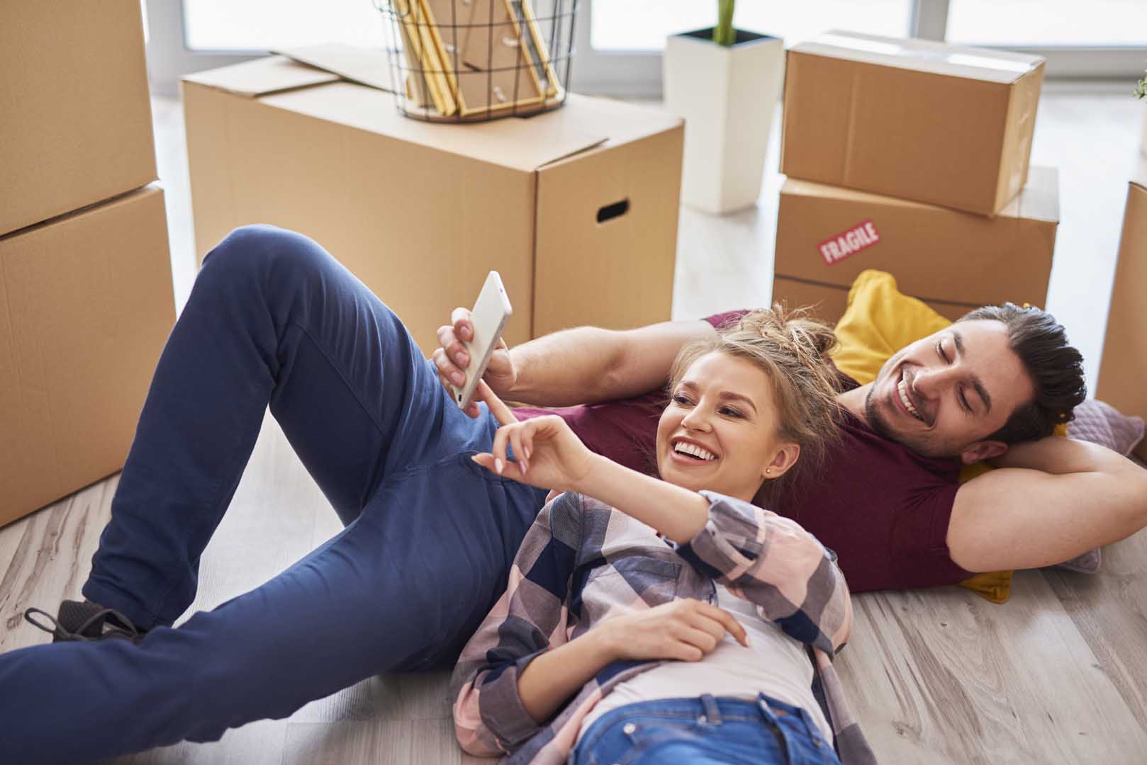 Young couple taking break from moving home